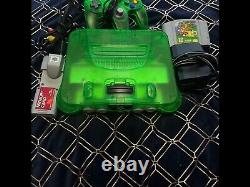Nintendo 64 jungle green console with controller, super Mario, rumble pack memory